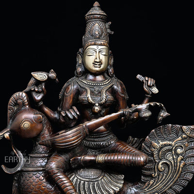 brass saraswati statue, closeup