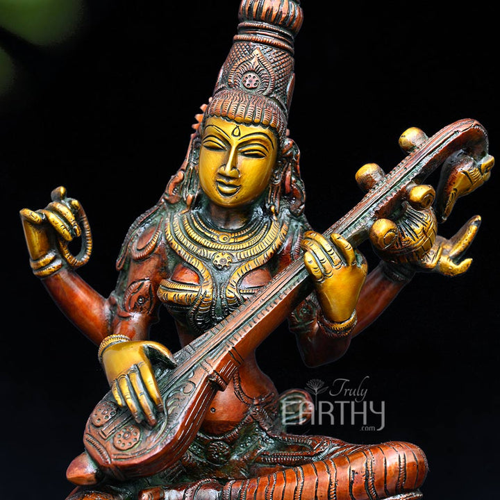 brass saraswati idol, closeup