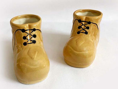 alt="brown shoes planter"