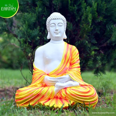 alt="meditating buddha statue"