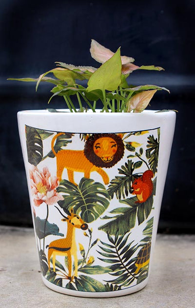 alt="jungle themed ceramic planter"