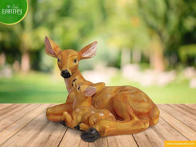 alt="deer with baby"