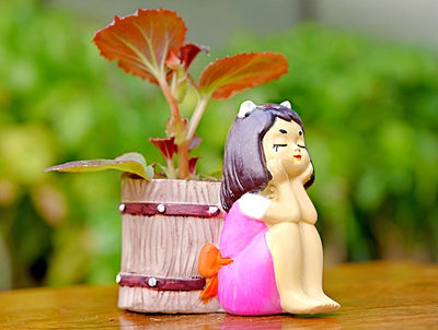 alt="musing girl planter"